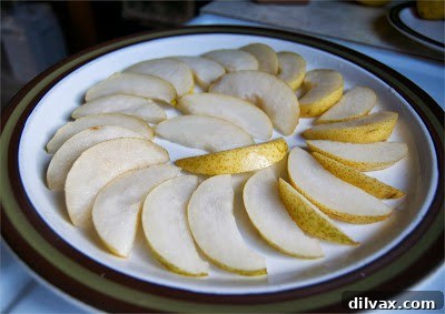 Golden Cinnamon Pear Rounds 4 Cinnamon Pear Slices on a rustic wooden board, ready to be enjoyed