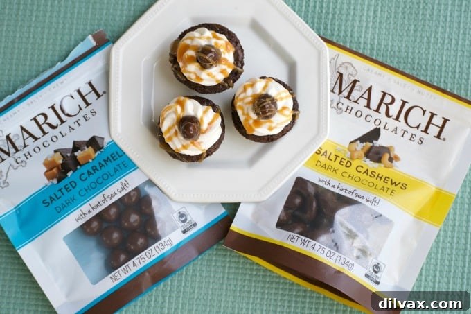 A selection of the delectable Salted Caramel Cashew Brownie Bites, beautifully arranged to highlight their gourmet appeal and the quality ingredients from Marich Chocolates.