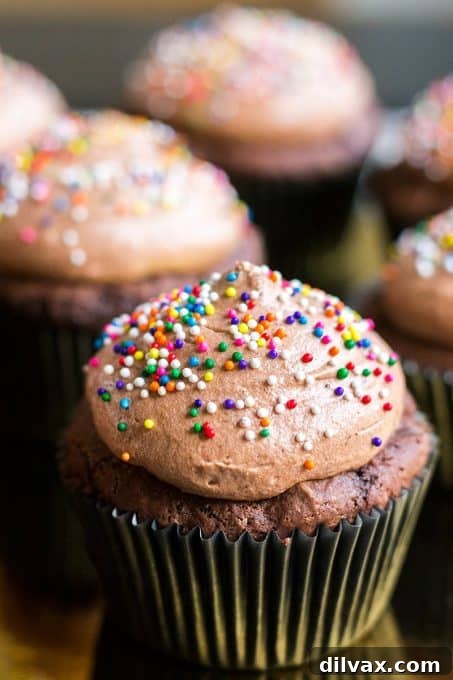 Decadent Easy Chocolate Pudding Cupcakes, topped with frosting, perfect for a sweet potluck treat.