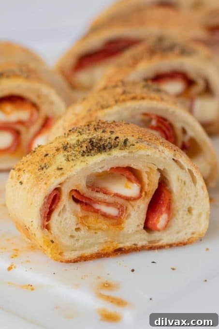 Sliced Pepperoni Bread, a savory and cheesy loaf perfect as a potluck appetizer or snack.