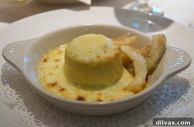 Sabatini's on Coral Princess offers exquisite Italian dining, including a highly recommended Artichoke Soufflé, a delightful start to any meal.