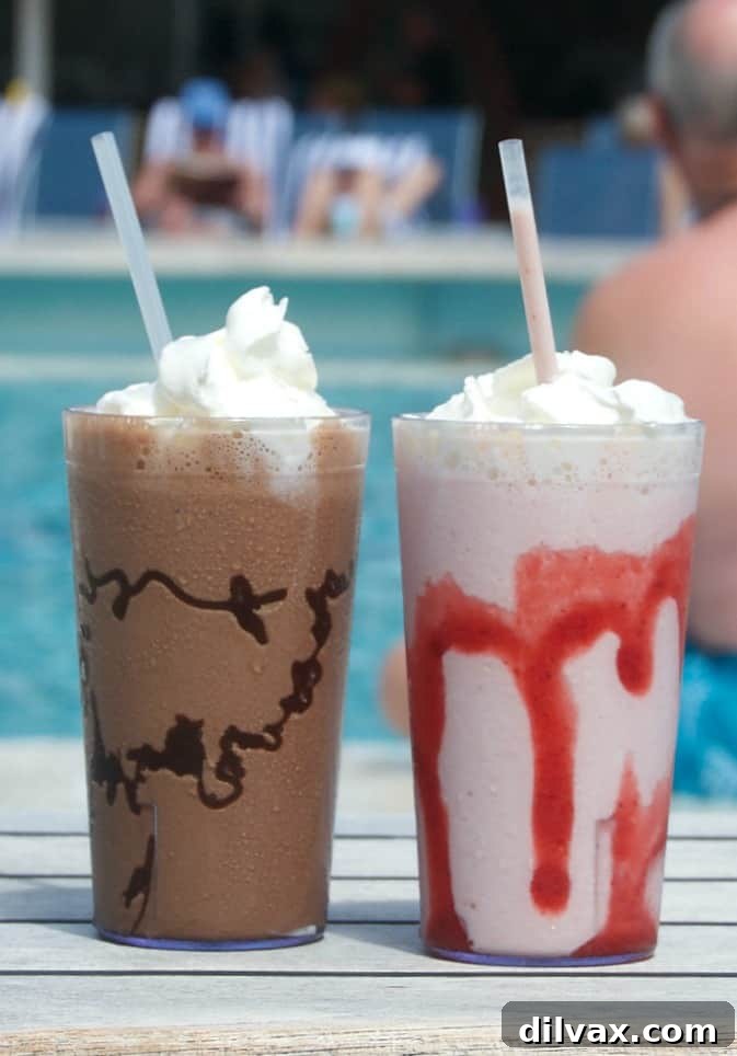 A close-up shot of a Double Chocolate Malted Milkshake in a glass, showcasing its rich texture and a hint of the chocolate syrup drizzled inside.
