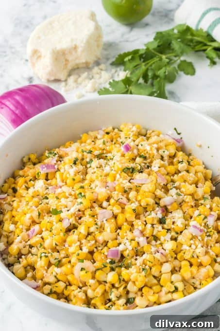 One-Pan Mexican Street Corn 7 An easy and delicious Mexican corn side dish served in a bowl.