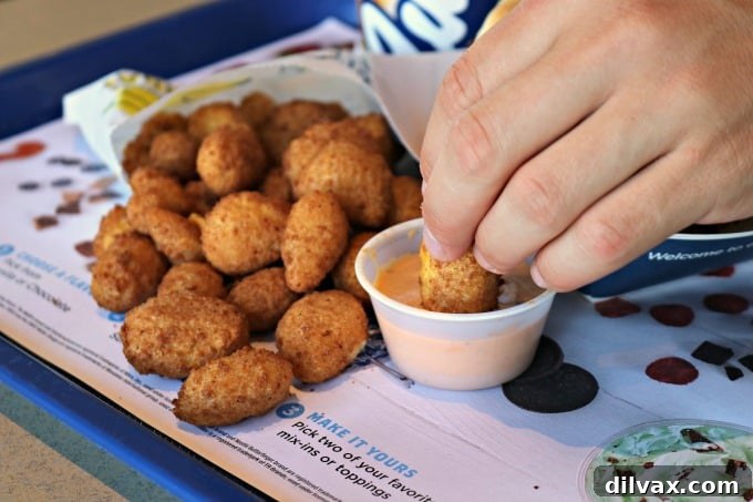 National Cheese Curd Day: Celebrate at Culver's 2 A plate of golden-brown deep-fried cheese curds with a side of dipping sauce at Culver's