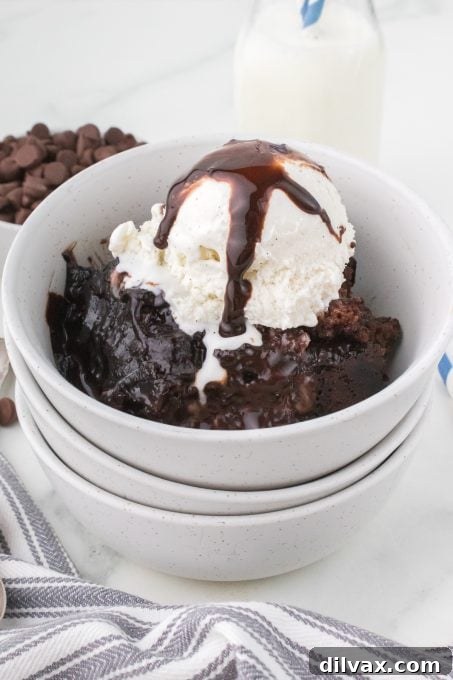 Decadent Peanut Butter Chocolate Pudding Cake 3 Slice of Chocolate Peanut Butter Pudding Cake with sauce