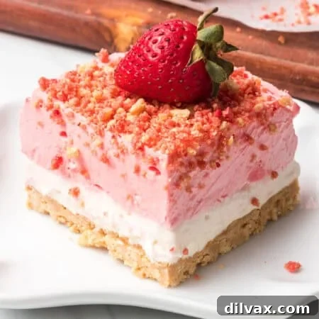 A single strawberry crunch bar on a white plate ready to be eaten.