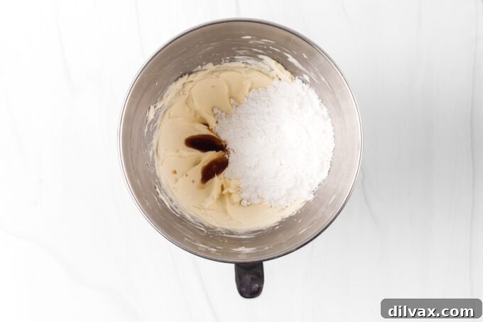 Ingredients for the cheesecake layer, including cream cheese, powdered sugar, and Cool Whip.