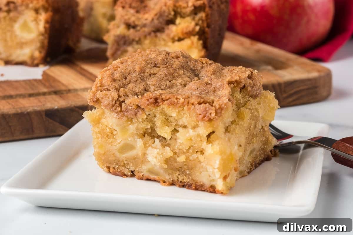 A square slice of Easy Apple Crumb Cake with a thick layer of streusel topping.