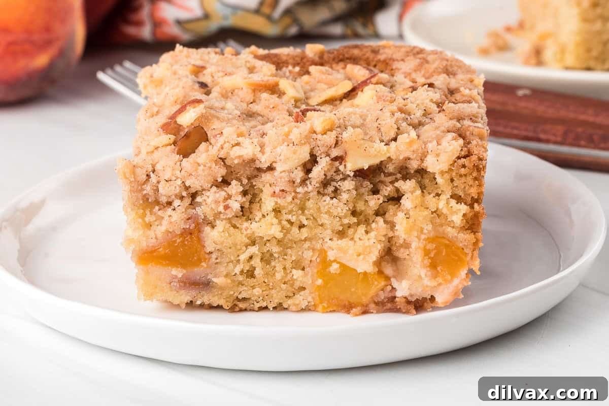 Crumb Cake with peaches on a plate.